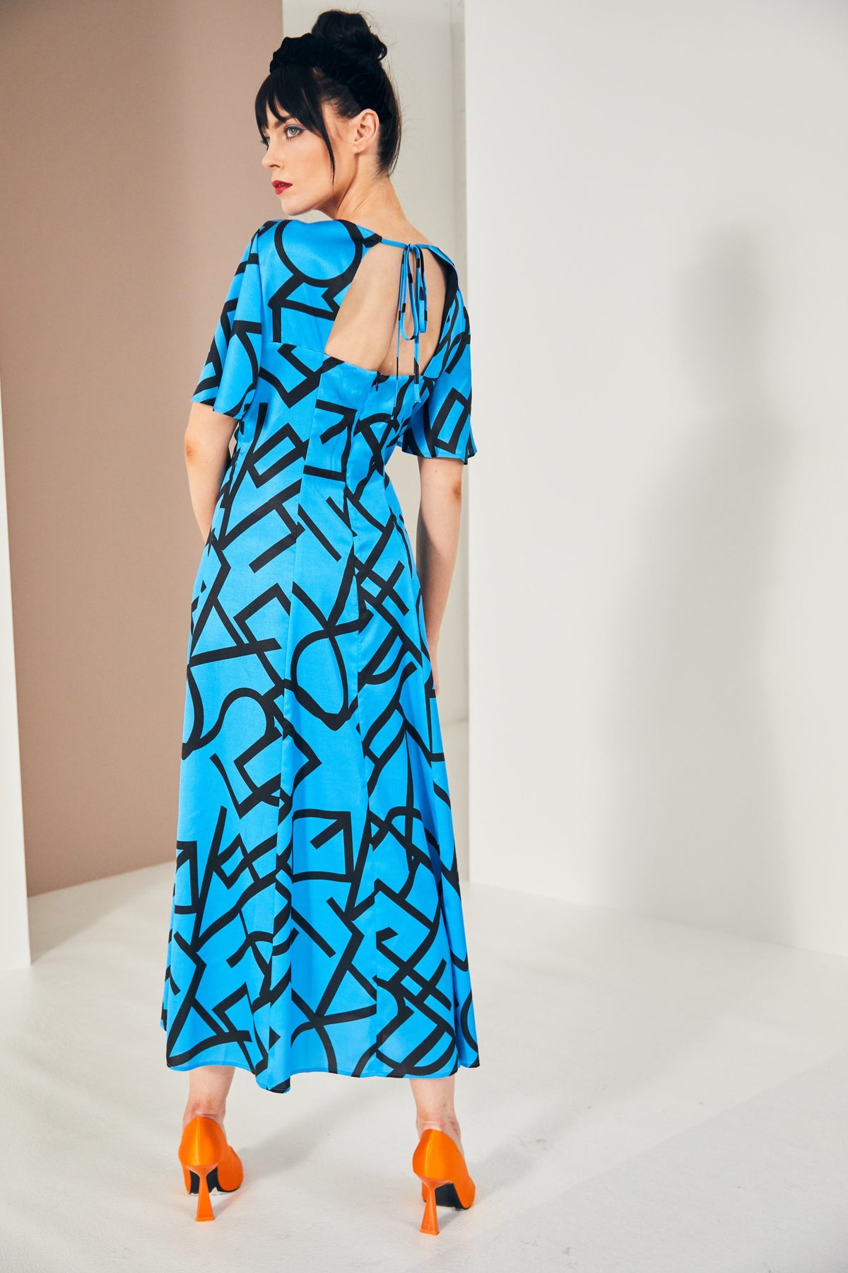 KCS23131 BLUE JEWEL Geometrical Dress/Cut Away Back Kate Cooper